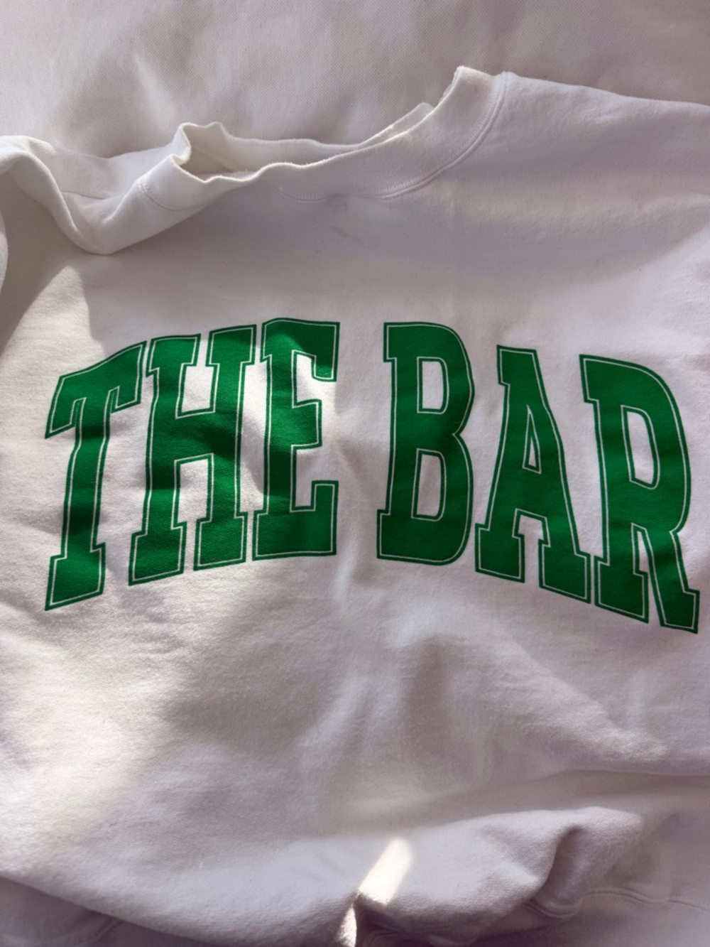 'THE BAR' sweatshirt with green letters